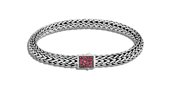 an intricate chain necklace by John Hardy with ruby accents